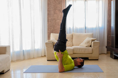 Man relaxing on sofa at home