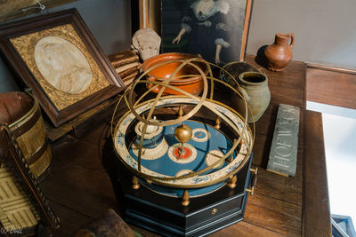 High angle view of antique objects on table