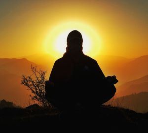 Silhouette of man at sunset