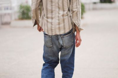 Midsection of man standing on street