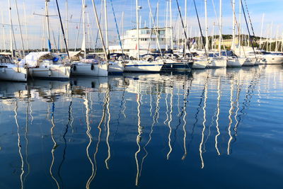 Boats moored at harbor