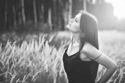 Young woman standing in field