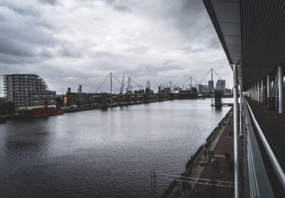 View of suspension bridge against cloudy sky