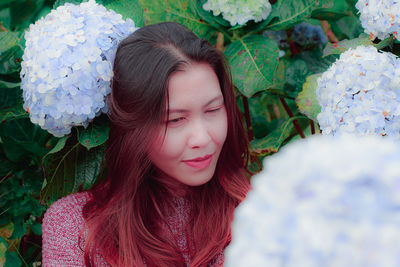 Portrait of a beautiful young woman with eyes closed