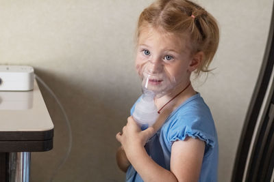 Portrait of cute baby girl at home