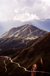 Aerial view of landscape against cloudy sky