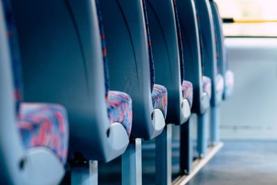 Close-up of blue bus seat