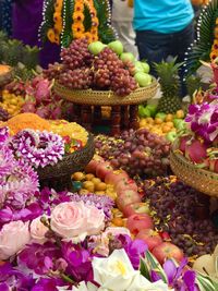 Various flowers on display at market stall