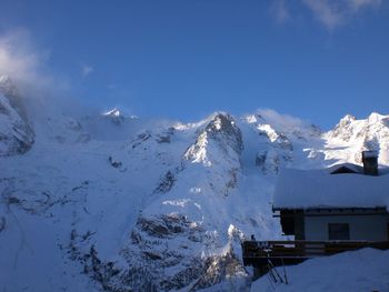 Panoramic view of landscape against blue sky