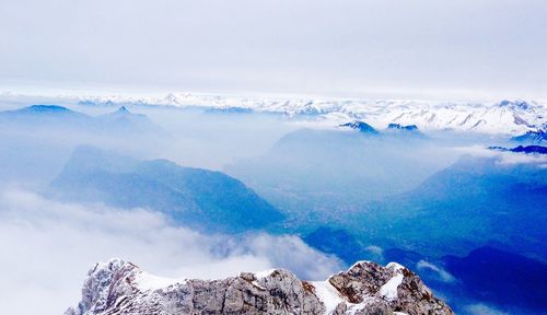 Scenic view of snowcapped mountains against sky