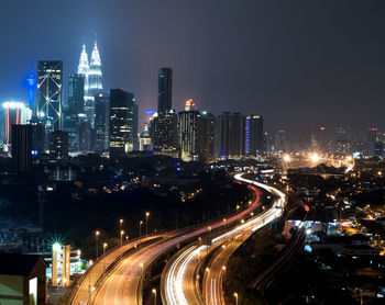 Traffic on highway in city at night