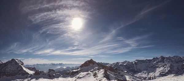 Scenic view of snowcapped mountains against sky