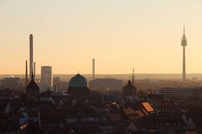 Cityscape against clear sky at morning