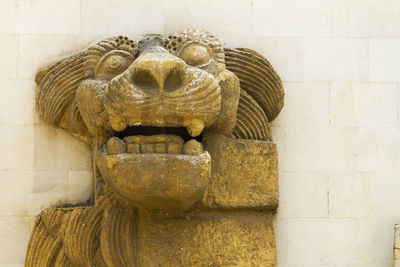 Close-up of statue against wall