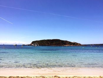 View of beach against blue sky