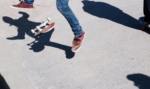 Low section of man skateboarding on sports ramp