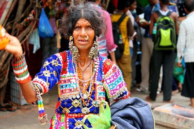 Portrait of senior woman wearing traditional clothing on street