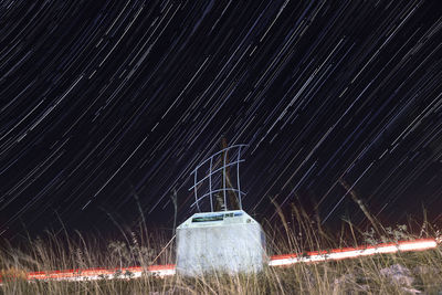 Light trails against sky at night