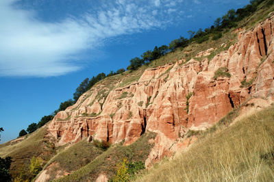 Succession of red and white clays with dinosaur fossils. geological reserve of rapa rosia, romania