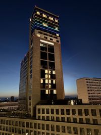 Low angle view of skyscrapers against clear blue sky