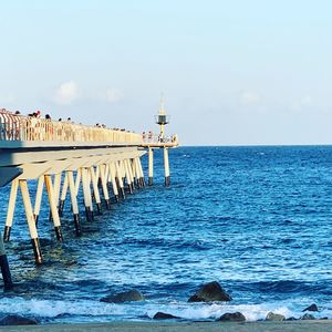 Pier over sea against sky