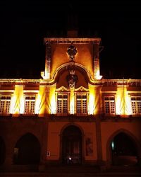 Illuminated building at night