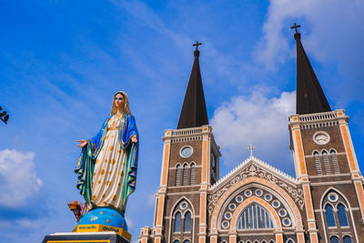 Low angle view of statue against building