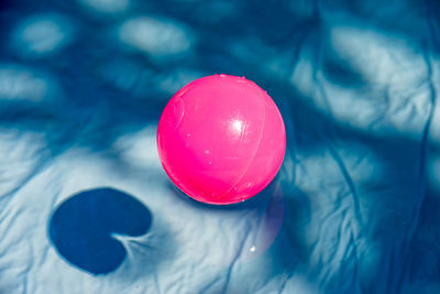 Close-up of red balloon floating on water