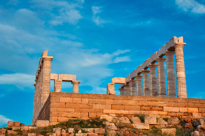 Poseidon temple ruins on cape sounio on sunset, greece