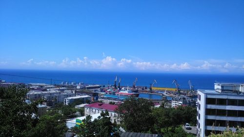High angle view of cityscape against sea