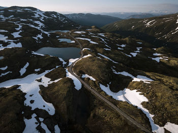 Aerial view of snowcapped mountains against sky