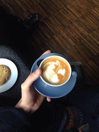 Close-up of coffee cup with coffee cup on table