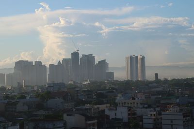 Buildings in city against sky