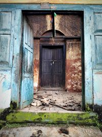 Closed door of old abandoned building