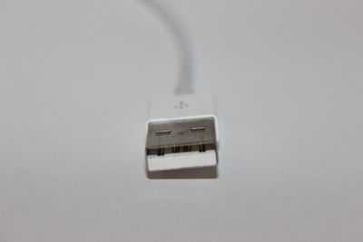High angle view of telephone pole against white background