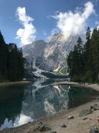 Scenic view of lake and mountains against sky