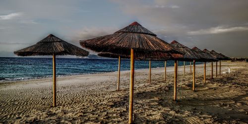 Built structure on beach against sky