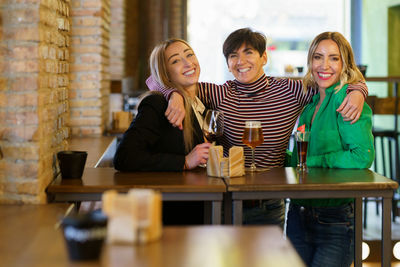 Portrait of happy family sitting at restaurant