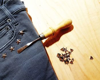 High angle view of jeans with star shape stud