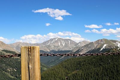 Scenic view of mountains against blue sky