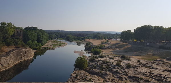 Scenic view of river against clear sky