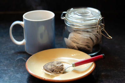 Making a cup of tea with a teabag.