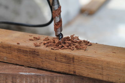 Close-up of drill on wood