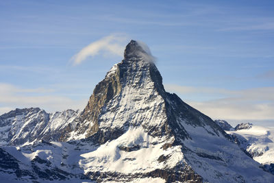 Scenic view of snowcapped mountain against sky