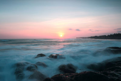 Scenic view of sea against sky during sunset