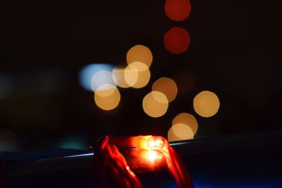 Close-up of illuminated string light at night