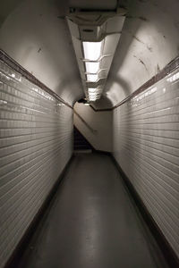 Illuminated tunnel at subway station