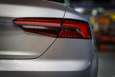 Close-up of red car on side-view mirror