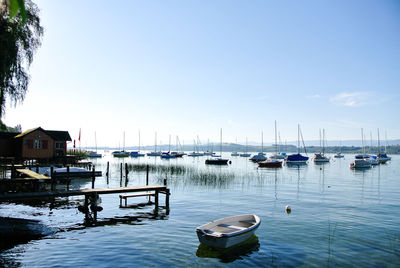 Boats moored at harbor