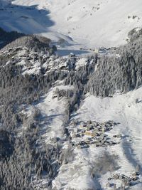 Aerial view of snowcapped mountains during winter